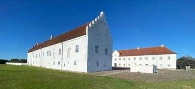 a large white building with a red roof at Vitskøl Kloster in Ranum