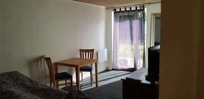 a room with a table and chairs and a window at Kyndestoft Bed & Breakfast in Holstebro