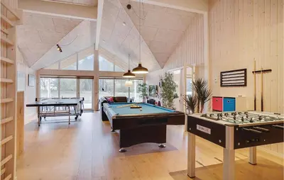 two billiard tables in a room with a pool table at 9 Bedroom Beautiful Home In Spøttrup in Spottrup