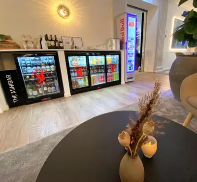 a room with three video games in the background at Hotel Skivehus in Skive