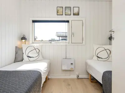 a bedroom with two beds and a window at 6 person holiday home in Lemvig in Lemvig