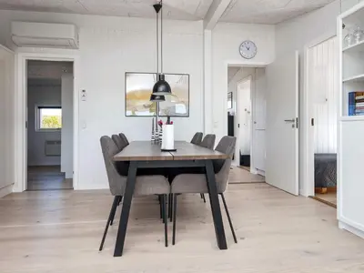 a dining room with a table and chairs at 6 person holiday home in Lemvig in Lemvig