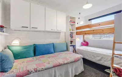 a bedroom with a bed and a bunk bed at Two-Bedroom Holiday Home In Spottrup in Spottrup