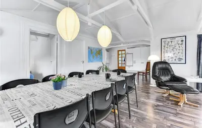 a meeting room with a long table and chairs at Five-Bedroom Holiday Home In Blokhus in Blokhus