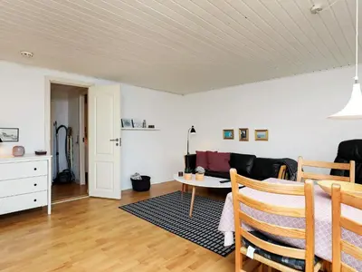 a living room with a couch and a table at 4 person holiday home in Nykøbing M-By Traum in Refshammer