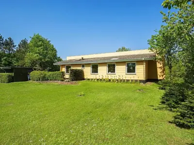 a house with a large yard in front of it at 6 person holiday home in Farsø-By Traum in Farsø