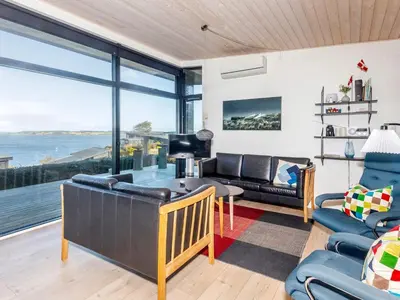 a living room with a view of the ocean at Modern Retreat with View - By Traum Ferienwohnungen in Løgstrup