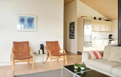 a living room with a couch and two chairs at Three-Bedroom Holiday Home In Lemvig in Lemvig