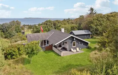 an aerial view of a small house on a hill at Three-Bedroom Holiday Home In Fur in Fur