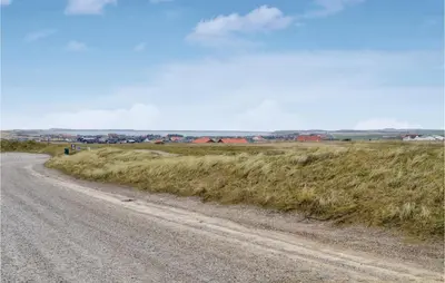 a dirt road in the middle of a field at Two-Bedroom Apartment In Lemvig in Lemvig