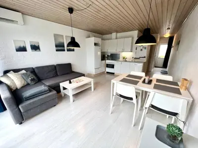 a living room with a couch and a table at Agger Tange Feriecenter lejligheder - 100 m fra Vesterhavet in Vestervig