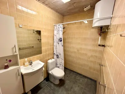 a bathroom with a toilet and a sink at Agger Tange Feriecenter lejligheder - 100 m fra Vesterhavet in Vestervig