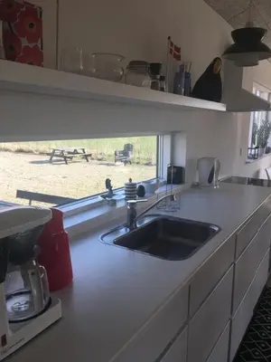 a kitchen counter with a sink and a window at B&B Hesselbjerg in Hesselbjerg