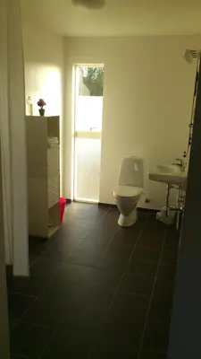 a bathroom with a toilet and a sink at B&B Hesselbjerg in Hesselbjerg