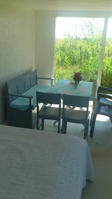 a room with a table and chairs and a window at B&B Hesselbjerg in Hesselbjerg