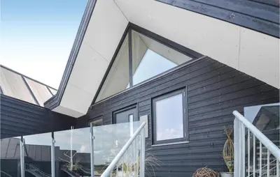 a house with large windows on the side of it at Two-Bedroom Apartment In Thisted in Thisted