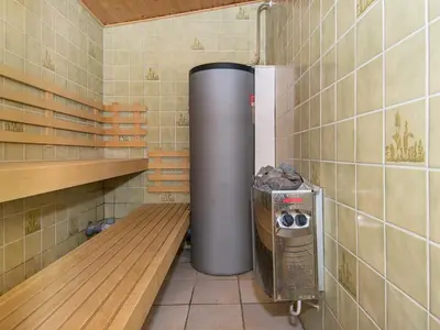 a small room with a trash can and a shelf at 14 person holiday home in Harboøre in Harboør