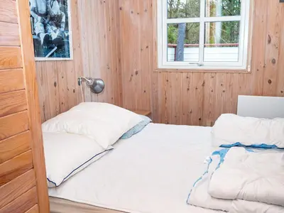 a bedroom with a bed and a window at 6 person holiday home in Thisted-By Traum in Thisted