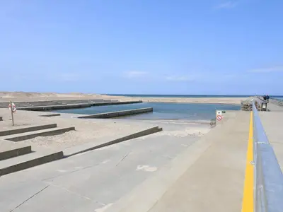 a walkway leading down to the beach with water at Holiday Home with Terrace & Fire Pit in Thisted
