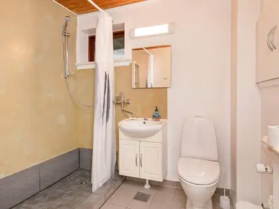 a bathroom with a toilet and a sink and a shower at Seaside Retreat in Hvalpsund-By Traum in Farsø