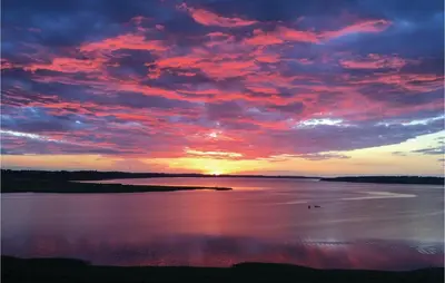 a sunset over a large body of water at Amazing Home In Løgstrup With Wifi in Løgstrup