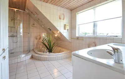 a bathroom with a tub and a sink at Lovely Home In Fur With Kitchen in Fur