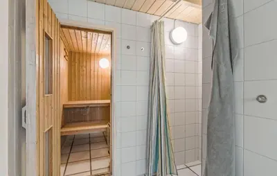 a bathroom with a shower and a shower curtain at 4 Bedroom Beautiful Home In Saltum in Saltum