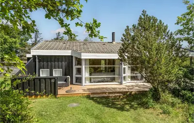 a home with a screened in porch in the yard at Nice Home In Vestervig With Wifi in Vestervig