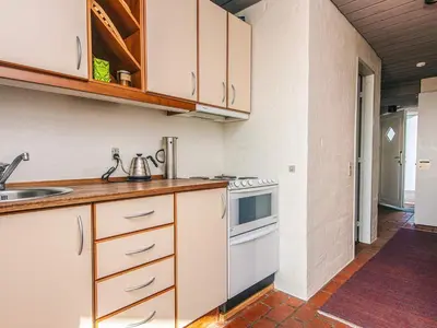 a kitchen with a sink and a stove at 6 person holiday home in Brovst in Brovst
