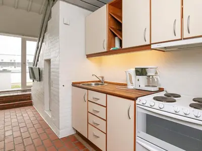 a kitchen with a sink and a stove at 6 person holiday home in Brovst in Brovst