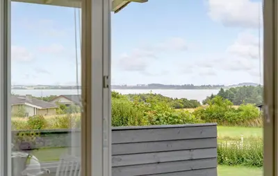 an open window with a view of the water at 3 Bedroom Stunning Home In Snedsted in Snedsted