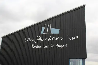 a building with a sign on the side of it at Glyngøre Camping in Glyngøre