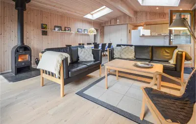 a living room with a couch and a stove at Amazing Home In Thisted With Kitchen in Thisted