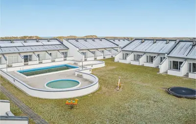an overhead view of a building with a swimming pool at Feriehotal Tranum Klit in Brovst