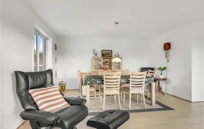 a kitchen and dining room with a table and chairs at 2 Bedroom Lovely Home In Thisted in Thisted