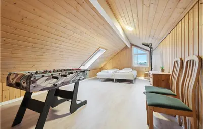 a room with a ping pong table and chairs at Gorgeous Home In Thisted With Sauna in Thisted