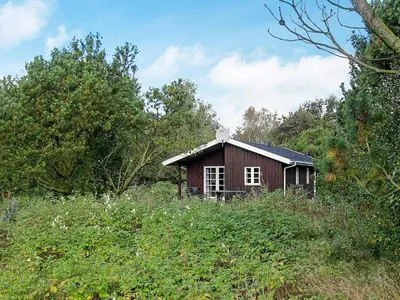 a small house in the middle of a field at Secluded Forest Retreat at Gjol-By Traum in Åbybro