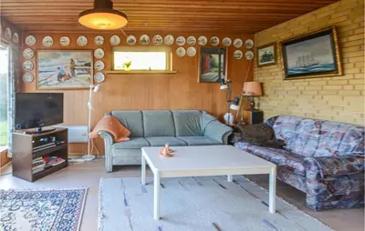 a living room with a couch and a coffee table at 2 Bedroom Beautiful Home In Fur in Fur
