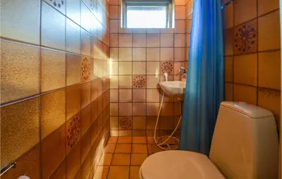 a bathroom with a toilet and a sink at 2 Bedroom Beautiful Home In Fur in Fur