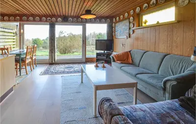 a living room with a couch and a table at 2 Bedroom Beautiful Home In Fur in Fur