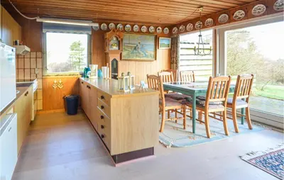 a kitchen and dining room with a table and chairs at 2 Bedroom Beautiful Home In Fur in Fur