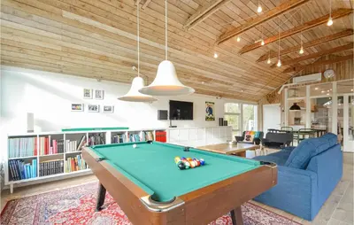a living room with a pool table in it at 4 Bedroom Beautiful Home In Vestervig in Vestervig