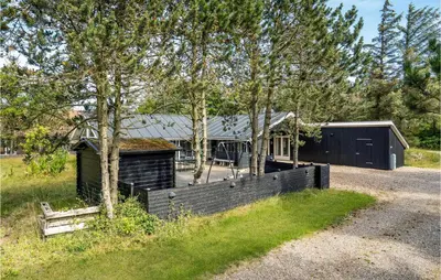 a house with a fence in front of it at 4 Bedroom Beautiful Home In Vestervig in Vestervig