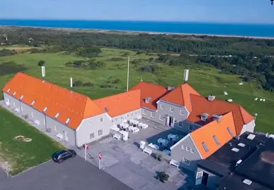 an aerial view of a building with orange roofs at Hotel Nor - Badehotellet in Fjerritslev