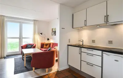 a kitchen with a table and a dining room at Lovely Apartment In Lemvig With Kitchen in Lemvig