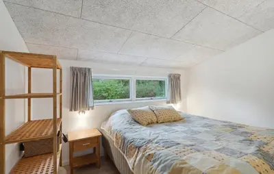 a bedroom with a bed and a window at Cozy Home In Hjerm With Kitchen in Hjerm