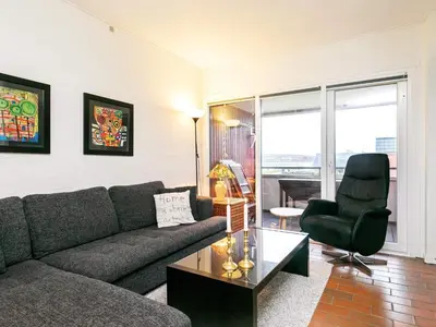 a living room with a couch and a chair at 5 person holiday home on a holiday park in Lemvig in Lemvig