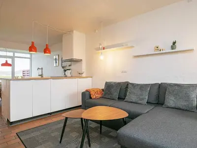a living room with a couch and a table at 4 person holiday home on a holiday park in Lemvig in Lemvig