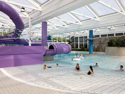 a group of people swimming in a water park at Seaside escape in Hanstholm in Hanstholm