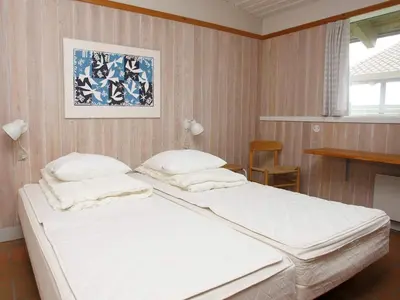 a bedroom with a large white bed in a room at Seaside escape in Hanstholm in Hanstholm